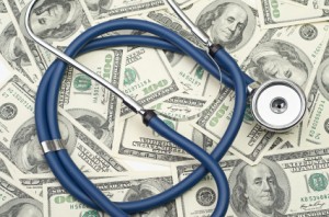 heap of dollars with stethoscope